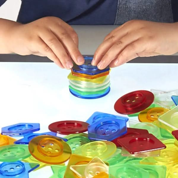 144 piece Translucent Stackable Buttons, 144 piece Stackable Translucent Buttons,Giant translucent lacing buttons shapes,children's counting resources,light box resources,Sensory light box resources toys, 144 piece Translucent Stackable Buttons,TickiT® Stackable Translucent Buttons offer an exciting and interactive way for children to explore colours, shapes, and patterns while enhancing fine motor skills. This set of 144 acrylic buttons comes in a variety of translucent colours—red, orange, yellow, green, 