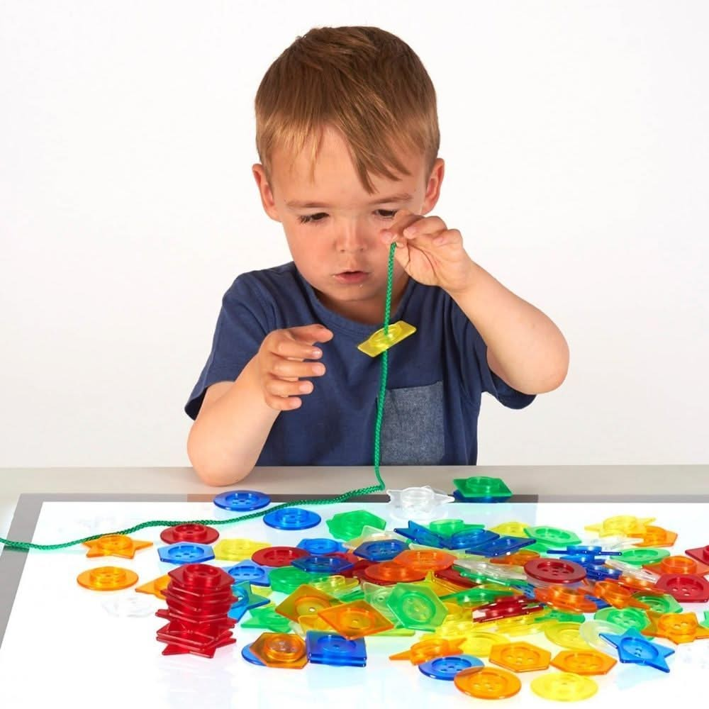 144 piece Translucent Stackable Buttons, 144 piece Stackable Translucent Buttons,Giant translucent lacing buttons shapes,children's counting resources,light box resources,Sensory light box resources toys, 144 piece Translucent Stackable Buttons,TickiT® Stackable Translucent Buttons offer an exciting and interactive way for children to explore colours, shapes, and patterns while enhancing fine motor skills. This set of 144 acrylic buttons comes in a variety of translucent colours—red, orange, yellow, green, 