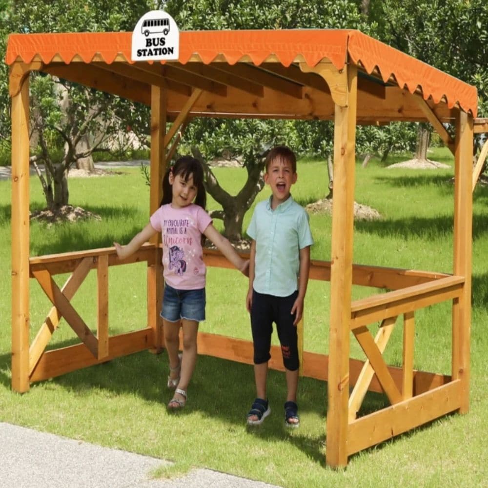 Childrens Wooden Outdoor Bus Station, Childrens Wooden Outdoor Bus Station,Playground role play equipment,outdoor role play furniture,outdoor role play toys, Childrens Wooden Outdoor Bus Station,Introducing the Childrens Wooden Outdoor Bus Station, the perfect addition to any outdoor play area. This high-quality role play bus station will keep children entertained while they wait for the bus. Constructed with a robust frame made from solid pine wood, this bus station is built to withstand years of play. The