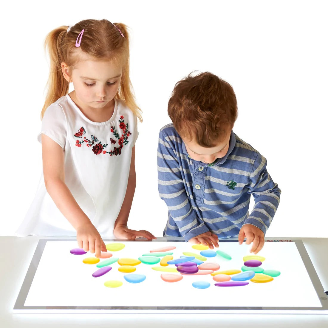 Clear Junior Rainbow Pebbles, Clear Junior Rainbow Pebbles, sensory pebbles,counting pebbles,yellowdoor,yellow door discount code, Clear Junior Rainbow Pebbles,The Clear Junior Rainbow Pebbles are an appealing early construction and manipulative set. The Clear Junior Rainbow Pebble set is ideal for developing fine motor skills and are fascinating viewed on a light panel. The smooth Clear Junior Rainbow Pebbles come in 3 shapes and 6 soft translucent colours, supplied in a con,Clear Junior RainbowThe Clear J