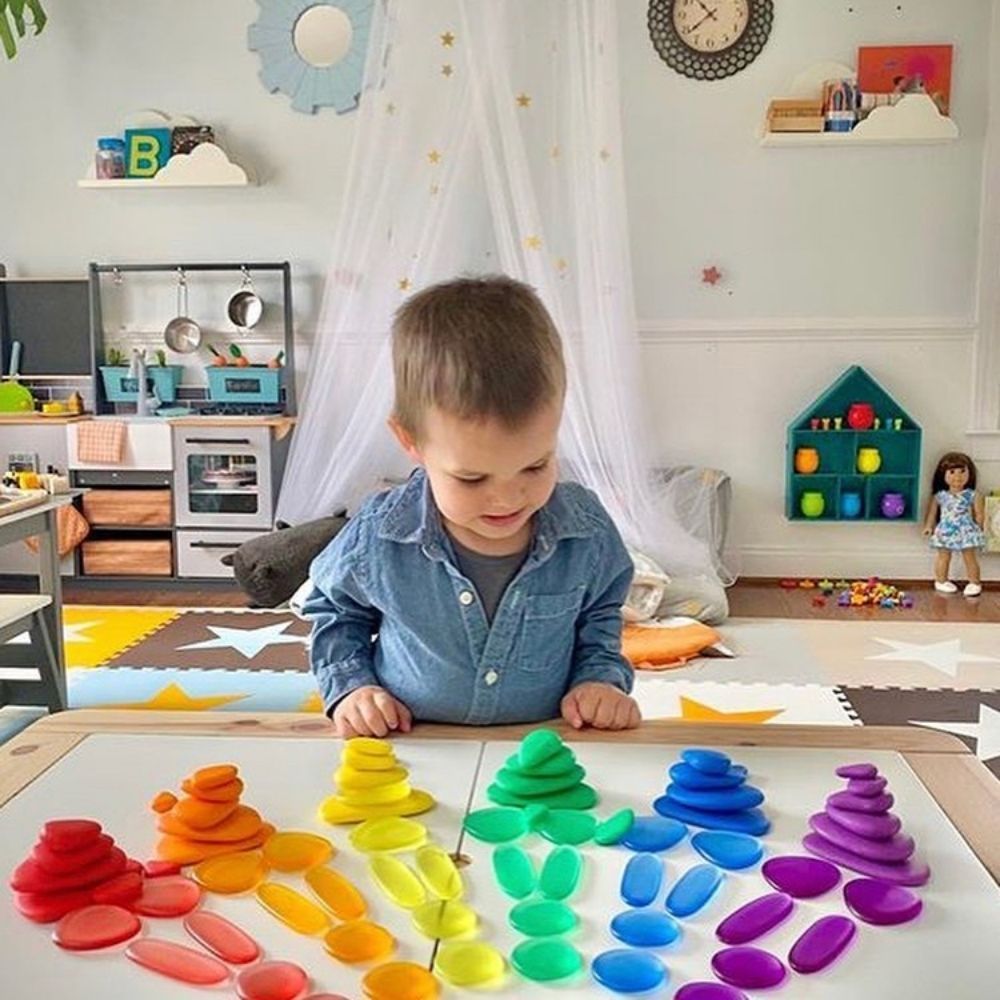 Clear Junior Rainbow Pebbles, Clear Junior Rainbow Pebbles, sensory pebbles,counting pebbles,yellowdoor,yellow door discount code, Clear Junior Rainbow Pebbles,The Clear Junior Rainbow Pebbles are an appealing early construction and manipulative set. The Clear Junior Rainbow Pebble set is ideal for developing fine motor skills and are fascinating viewed on a light panel. The smooth Clear Junior Rainbow Pebbles come in 3 shapes and 6 soft translucent colours, supplied in a con,Clear Junior RainbowThe Clear J