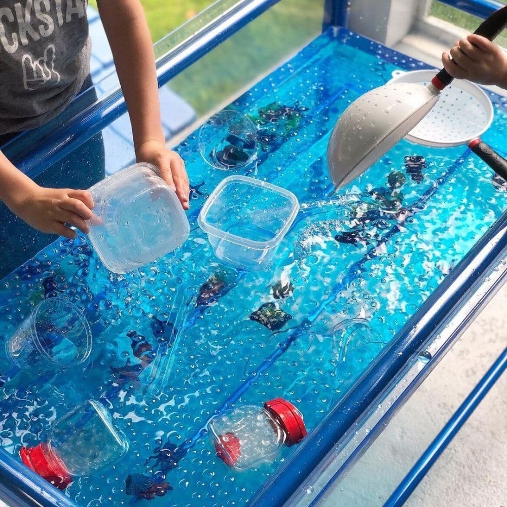 Clear Water Tray and Stand 58cm, Clear Water Tray 58cm Blue Stand, Childrens water tray,garden water tray,sand tray,sand pit, Clear Water Tray and Stand 58cm,The 58cm Clear Water Play Table: A Versatile and Interactive Play Resource The 58cm Clear Water Play Table is a fantastic addition to any early childhood learning environment. It offers a wide range of benefits for young learners and educators. Here are some key features and advantages of this play table: 1. GenerousThe 58cm Clear Water Play Table: A V