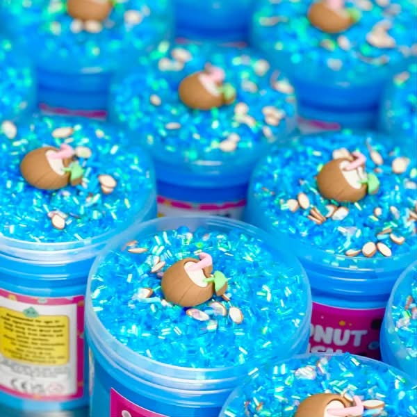 Coconut Crush Putty, Coconut Crush Putty,Putty,Sensory Putty,slimepartyuk, Slime party,Blossom burst sensory putty, Coconut Crush Putty,Our Coconut Crush putty is like a holiday in a jar! The duo of vivid blue putty, topped with shimmering blue bingsu beads, coconut themed sprinkles and a lush coconut charm, make for a sensory, tropical paradise in your own home! Putties are air reactive and will dry out of left out. Always return to the container afte,CoconutOur Coconut Crush putty is like a holiday in a j