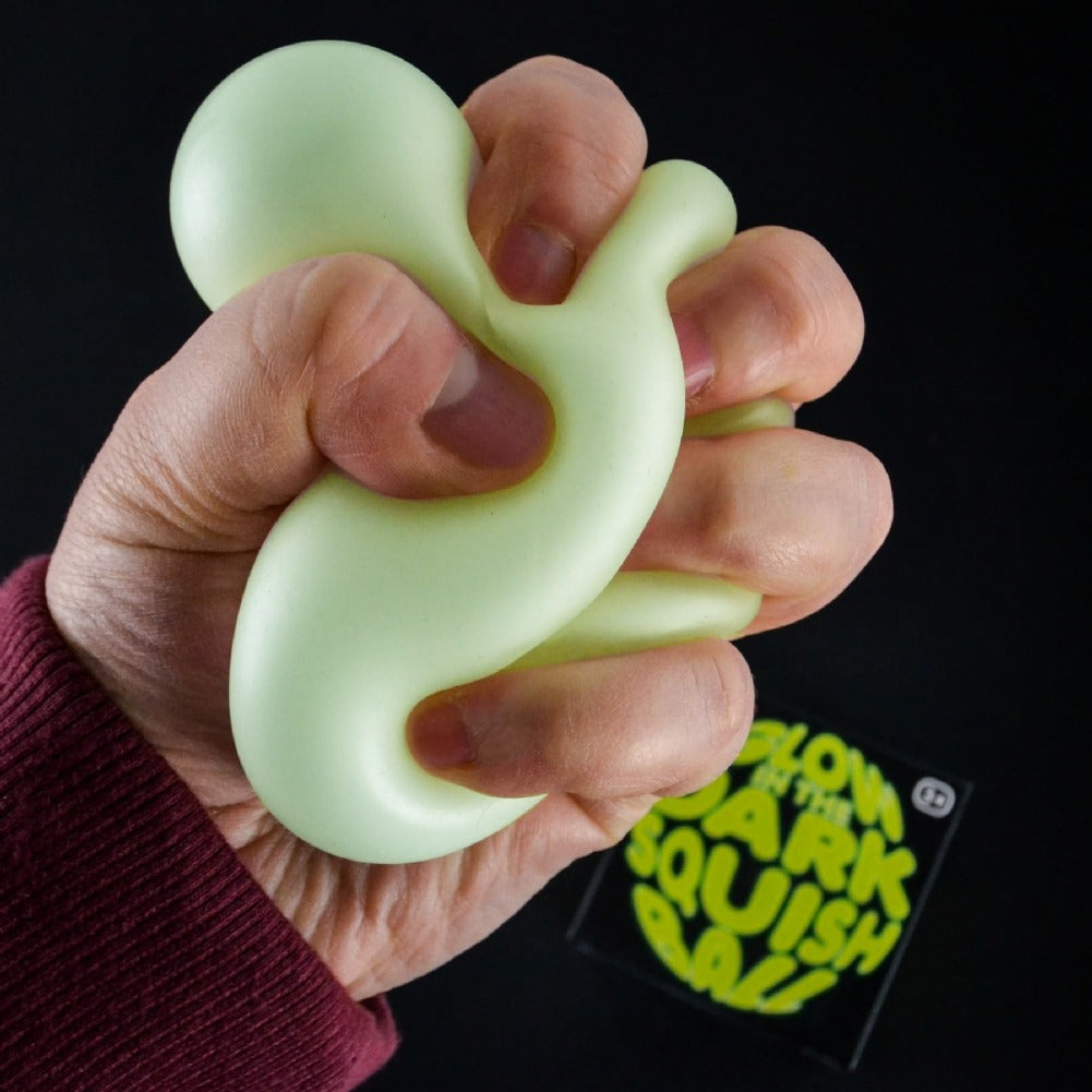 Glow in the Dark Squish Ball Fidget Toy, Glow in the Dark Squish Ball Fidget Toy, Glow in the dark squish ball. glow in the dark fidget toys, glow in the dark sensory toys, Glow in the Dark Squish Ball Fidget Toy,Glow in the Dark Squish Ball Fidget Toy – The Ultimate Stress Reliever! Introducing the Glow in the Dark Squish Ball, a super fun and calming fidget toy that glows bright green in the dark! While it appears as an 'off white' colour in normal light, after exposure to light or under UV blacklight, th