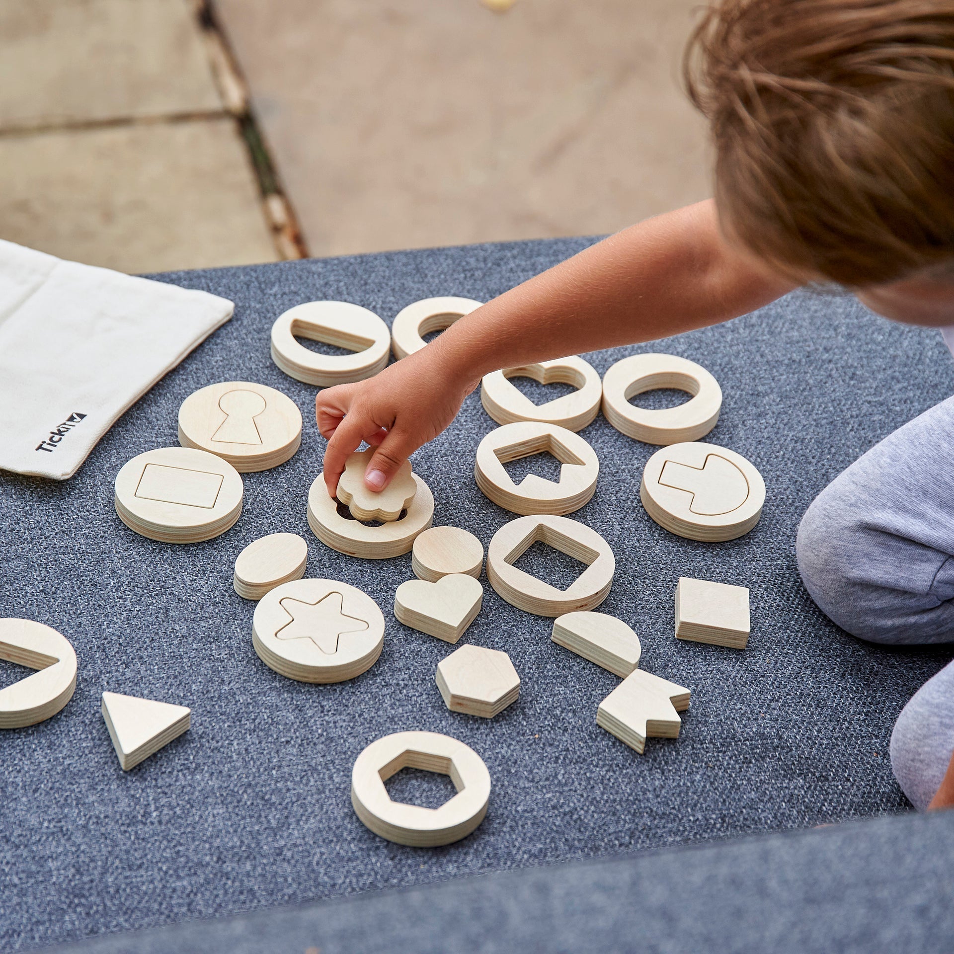 Inside Outside Wooden Shapes, Inside Outside Wooden Shapes,TickIT Inside Outside Wooden Shapes,Shape sorting toys,Puzzle solving toys, Inside Outside Wooden Shapes,The TickiT® Inside Outside Wooden Shapes set offers endless opportunities for your child to develop essential skills through hands-on exploration of shapes and patterns. This thoughtfully designed set includes 14 beautifully crafted wooden discs, each containing a unique shape that can be removed and used for tracing, ,Inside Outside WoodenThe Ti