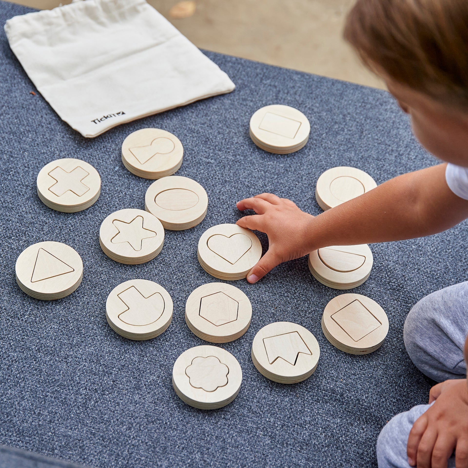 Inside Outside Wooden Shapes, Inside Outside Wooden Shapes,TickIT Inside Outside Wooden Shapes,Shape sorting toys,Puzzle solving toys, Inside Outside Wooden Shapes,The TickiT® Inside Outside Wooden Shapes set offers endless opportunities for your child to develop essential skills through hands-on exploration of shapes and patterns. This thoughtfully designed set includes 14 beautifully crafted wooden discs, each containing a unique shape that can be removed and used for tracing,The TickiT® Inside Outside Wo