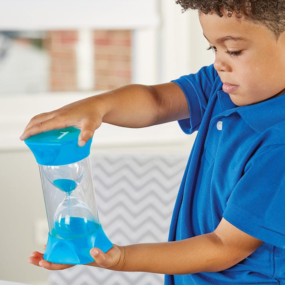 Jumbo Sand Timer (1-Minute), Jumbo Sand Timer (1-Minute), Jumbo sand timer, large sand timer,sand timer, Jumbo Sand Timer (1-Minute),The Jumbo Sand Timer (1-Minute) is a versatile and educational tool that offers both teachers and parents an effective way to manage time and help children understand the concept of time passing. Its jumbo size, combined with the vibrant blue sand particles, makes it visually engaging for children. Jumbo Sand TimerThe Jumbo Sand Timer (1-Minute) is a versatile and educational 