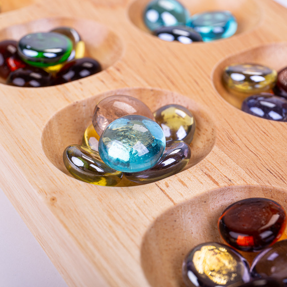 Mancala, Mancala,Mancala Game,Wooden Mancala Game,Counting Game,Counting Resources, Mancala,Bigjigs Mancala Game The Bigjigs Mancala is a classic two-player board game that combines strategy with skill. Simple yet engaging, the goal is to collect more marbles than your opponent by strategically dropping marbles into the various holes on the board. This traditional wooden game consists of two rows with six hol,MancalaBigjigs Mancala Game The Bigjigs Mancala is a classic two-player board game that combines st