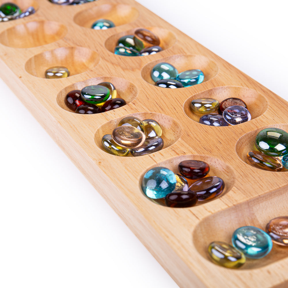 Mancala, Mancala,Mancala Game,Wooden Mancala Game,Counting Game,Counting Resources, Mancala,Bigjigs Mancala Game The Bigjigs Mancala is a classic two-player board game that combines strategy with skill. Simple yet engaging, the goal is to collect more marbles than your opponent by strategically dropping marbles into the various holes on the board. This traditional wooden game consists of two rows with six hol,MancalaBigjigs Mancala Game The Bigjigs Mancala is a classic two-player board game that combines st