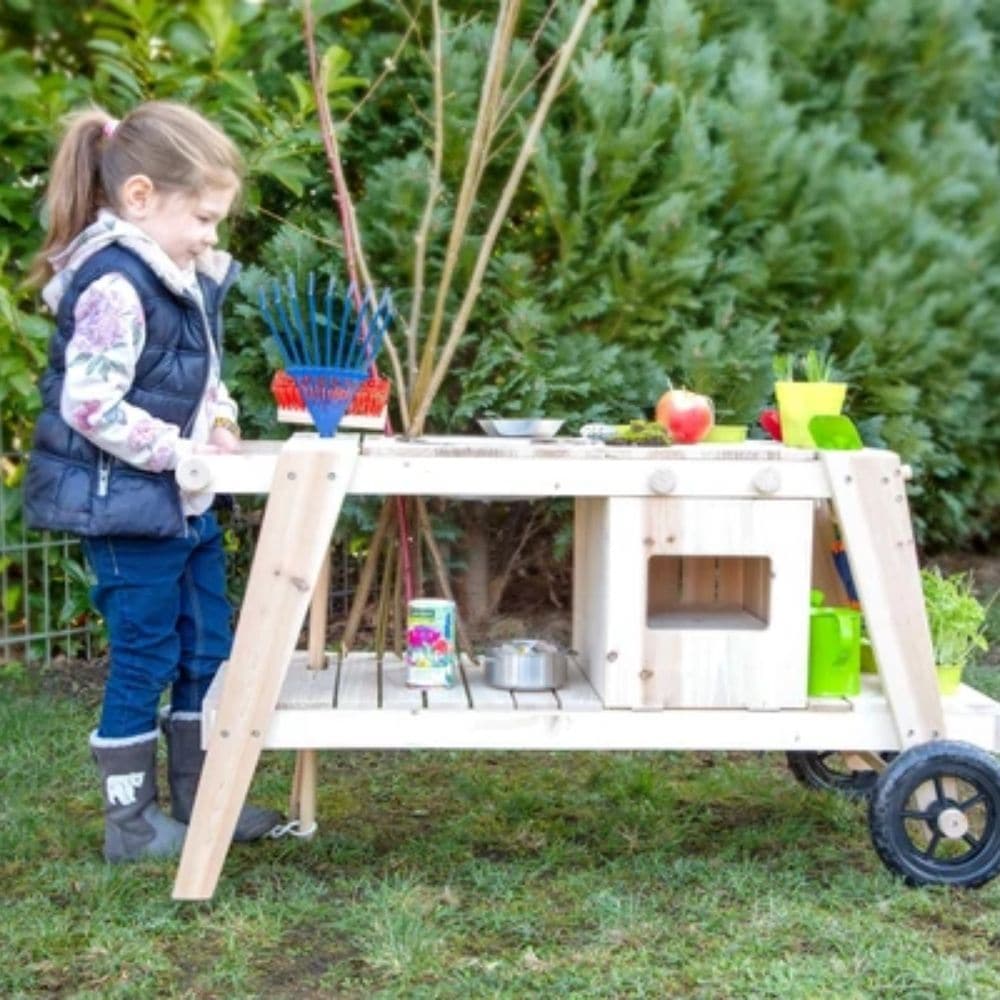 Mud Kitchen, Mud Kitchen,Mud Kitchen,Mud kitchen,sensory mud kitchen,mud kitchen school,nursery mud kitchen,playground equipment storage,playground storage equipment,outdoor wooden storage, Mud Kitchen,Thanks to the indestructible wheels, the Mud Kitchen can be pushed around as much as the children want! The Mud Kitchen has an oven two knobs that make clicking sounds, a large mud bowl, two small mud pots and two flower pots made of metal as well as recesses, hooks, and a storage surface for organising garde