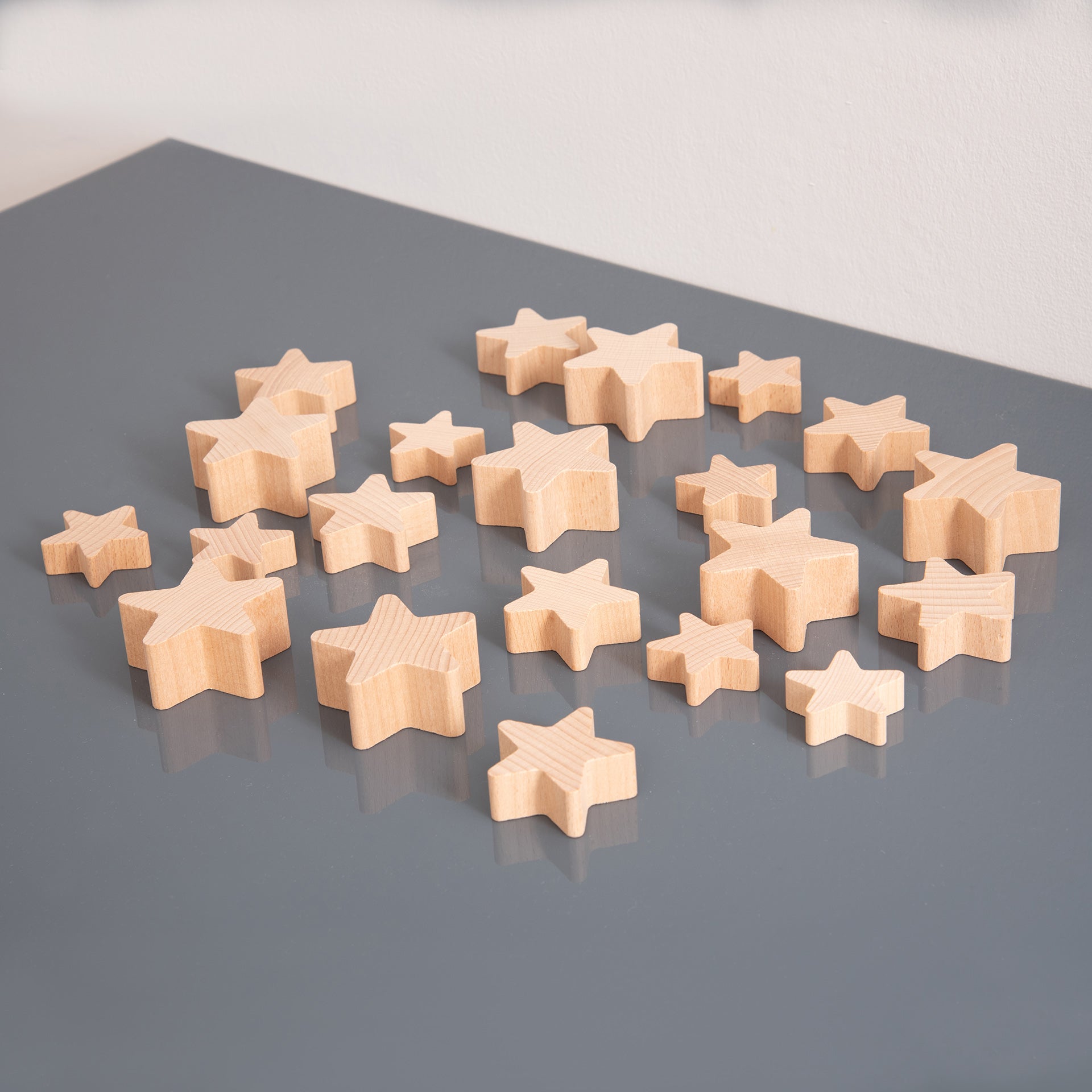 Natural Wooden Stars, Natural Wooden Stars,TickIT Natural Wooden Stars,TickIT Wooden resources, Natural Wooden Stars,Our TickiT® Natural Wooden Stars are made from beautiful smooth solid beechwood with a natural woodgrain finish. An inspiring addition to our heuristic play range. Chunky and tactile, they are easy for small hands to manipulate, stack, count, sequence and explore. These simple and curious natural smooth wooden stars wi,NaturalOur TickiT® Natural Wooden Stars are made from beautiful smooth sol