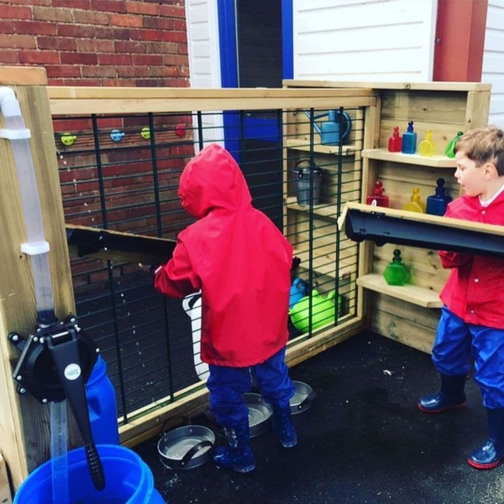 Outdoor Wooden Water Channelling Unit, Outdoor Wooden Water Channelling Unit,school Playground equipment,school playground equipment,school playground wooden houses, Outdoor Wooden Water Channelling Unit,The Outdoor Wooden Water Channelling Unit is an exciting, interactive channelling unit where the children can choose the layout and pump the water independently. Water is captured and collected into two large buckets. The channelling can be hooked into different positions. The Outdoor Wooden Water Channelli