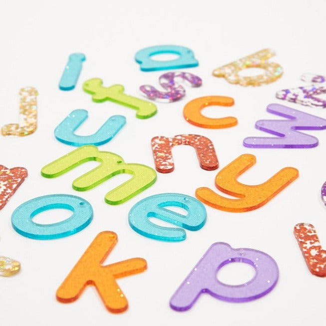 Rainbow Glitter Letters - Pk26, Rainbow Glitter Letters - Pk26,TickIT Rainbow Glitter Letters,Rainbow Glitter Letters,Rainbow Glitter Letters,sensorytoys4u discount code, Rainbow Glitter Letters - Pk26,The Rainbow Glitter Letters come as a set of 26 sparkling glitter lower case letters a-z in a child friendly font made from colourful translucent 3mm acrylic. The Rainbow Glitter Letters come in 7 colours, with the vowels in turquoise. Ideal for use on a light panel to make letter recognition interesting and 