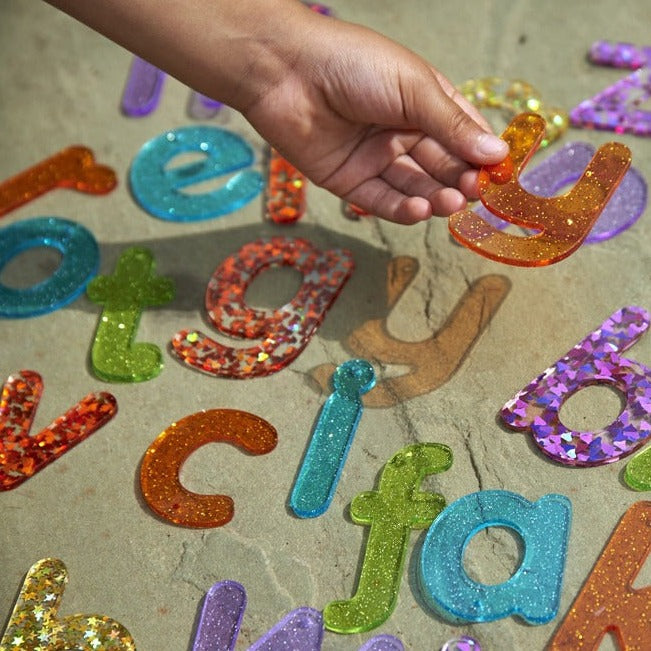 Rainbow Glitter Letters - Pk26, Rainbow Glitter Letters - Pk26,TickIT Rainbow Glitter Letters,Rainbow Glitter Letters,Rainbow Glitter Letters,sensorytoys4u discount code, Rainbow Glitter Letters - Pk26,The Rainbow Glitter Letters come as a set of 26 sparkling glitter lower case letters a-z in a child friendly font made from colourful translucent 3mm acrylic. The Rainbow Glitter Letters come in 7 colours, with the vowels in turquoise. Ideal for use on a light panel to make letter recognition interesting and 