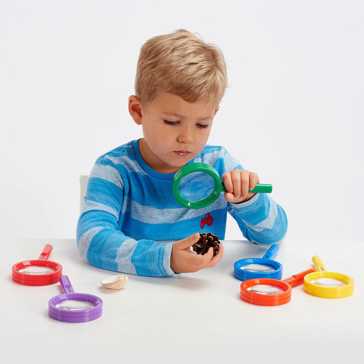 Rainbow Magnifiers Pack of 6, Rainbow Magnifiers Pack of 6,TickiT® Rainbow Magnifiers,TickiT® Rainbow,TickiT® Toys, Rainbow Magnifiers Pack of 6,TickiT® Rainbow Magnifiers are the perfect size for small hands. The brightly coloured hand magnifiers are an ideal way for your child to examine and investigate items from their natural environment, such as leaves, soil, natural patterns and insects.The lens enables up to 3x magnification for close upTickiT® Rainbow Magnifiers are the perfect size for small hands.