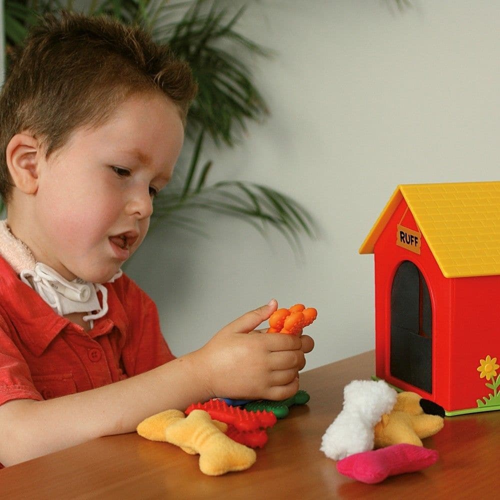 Ruff's House Teaching Tactile Set, Ruff's House Teaching Tactile Set,Learning Resources Ruff's House Teaching Tactile Set, Ruff's House Teaching Tactile Set,Ruff's House Teaching Tactile Set Embark on a sensory journey with Ruff the dog and his collection of textured bones in Ruff's House Teaching Tactile Set. Designed to engage young explorers, this set provides a unique and playful way to develop tactile awareness and fine motor skills. Children will love helpingRuff's House Teaching Tactile Set Embark on