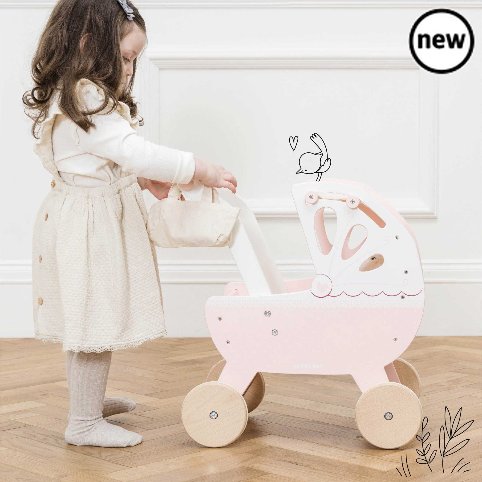 Sweet Dreams Doll Pram, , Sweet Dreams Doll Pram,Take dolly out and about on all their childhood adventures with our beautiful, traditional wooden doll pram stroller. Lovingly designed, this little beauty is full of nostalgia, adorned with prettiest, delicate detailing with heart and lace motifs. Featuring a soft pastel pink, cream and fresh white colour palette, it',Sweet Dreams Doll PramTake dolly out and about on all their childhood adventures with our beautiful, traditional wooden doll pram stroller. Lo