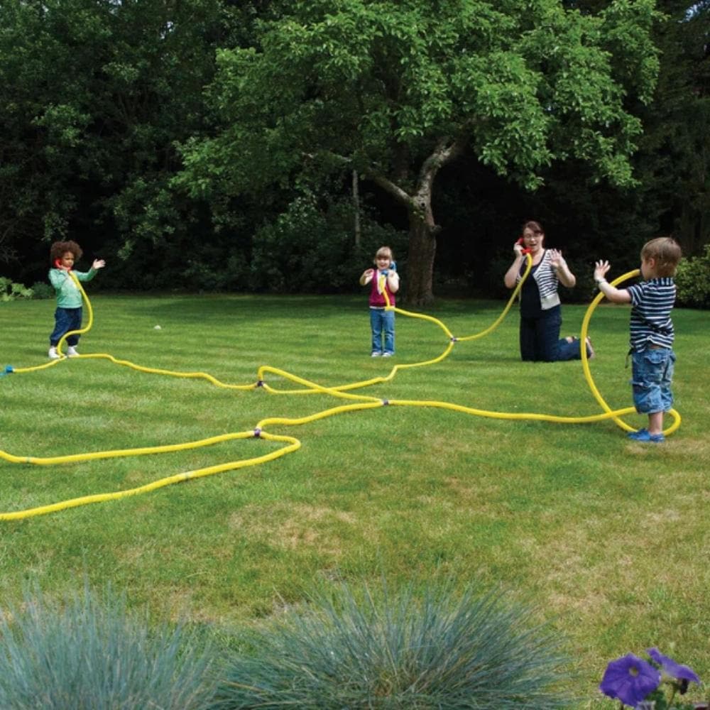 Talking Tubes Telephone Exchange, Talking Tubes Telephone Exchange, Talking tubes, TickIT Talking tubes, Taling tubes toy, Outdoor talking tubes, talk through pipes toy, Talking Tubes Telephone Exchange,The TickiT® Talking Tubes® Telephone Exchange offers an exciting and interactive way for children to explore communication. With flexible yellow tubing and plug-in handsets, this unique system allows kids to send messages to each other across multiple "networks" — whether indoors, outdoors, between rooms, or