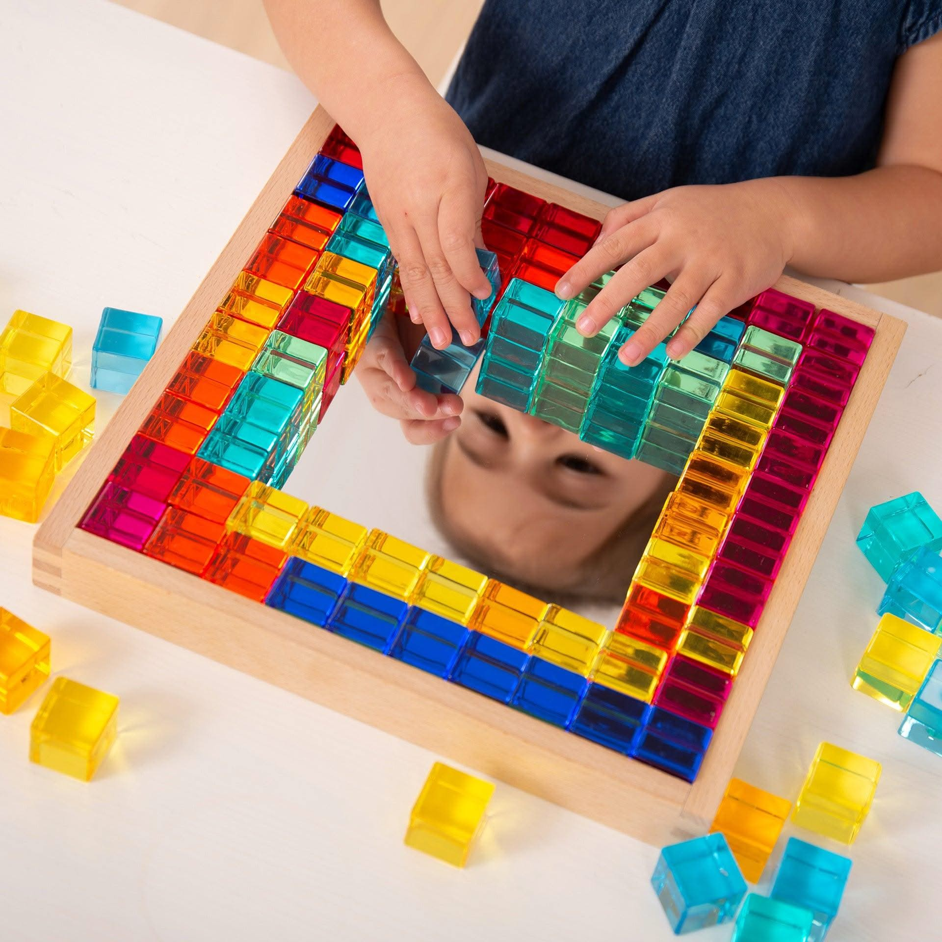 TickiT Gem Cube Mirror Tray, TickiT Gem Cube Mirror Tray,TickiT Toys,TickiT Resources,TickiT Mirror tray,TickiT mirrors, TickiT Gem Cube Mirror Tray,TickiT® Gem Cube Mirror Tray – A Colourful and Captivating Learning Tool for Young Minds Introduce your child to the joy of discovery and creative play with the TickiT® Gem Cube Mirror Tray. This beautifully designed set includes 100 sparkling gem cubes in a sturdy, high-quality beechwood tray, making it both anTickiT® Gem Cube Mirror Tray – A Colourful and Cap