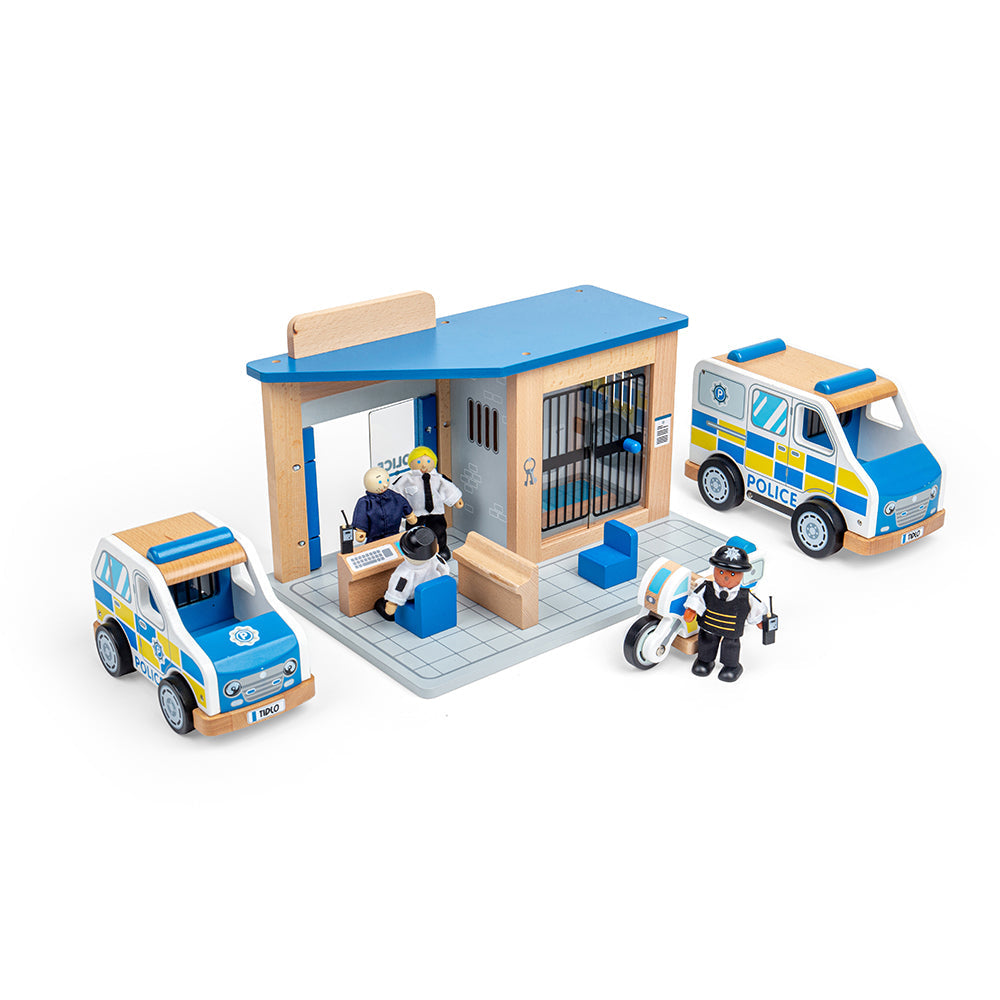 Tidlo Police Toy Bundle, Tidlo Police Toy Bundle, Tidlo toys, Wooden police cars,Toy Police cars,Toy police station,Wooden Police Station, Tidlo Police Toy Bundle – Keep the Streets Safe with Small-World Play! Get ready for action-packed pretend play with the Tidlo Police Toy Bundle! Aspiring young officers can patrol the streets, catch criminals, and lock up baddies with this high-quality wooden police playset. Featuring a Police Station, Police Car, Police Van, and a team of Police Officers & Prisoner fig