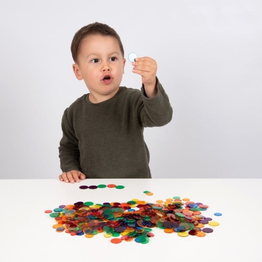 Translucent Colour Counters Set of 1000, Translucent Colour Counters Set of 1000.Translucent Colour Counters,round counters,childrens counting resources,light box resources, Translucent Colour Counters Set of 1000,Discover the endless possibilities of learning with our Translucent Colour Counters Set. Perfect for educators, parents, and kids, this expansive set offers a vibrant array of 1000 round transparent counters, each with a diameter of 25mm. Whether you're illuminating them on a light box or using th