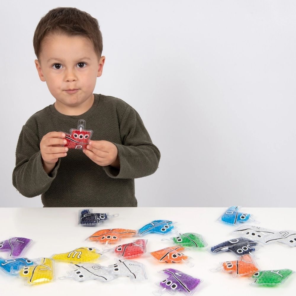 Alpha Rainbow Gel Boats Pack 26, Rainbow Gel Alpha Boats Pack 26,Squidgy sparkle shapes,light box resources,sensory light box resources,squidgy sensory toys,tactile toys, Alpha Rainbow Gel Boats Pack 26,Rainbow Gel Alpha Boats are an engaging, multi-functional learning tool designed to bring literacy and sensory exploration to life. These vibrant gel-filled boats feature capital letters on one side, the corresponding lowercase letters on the other, and vowels displayed in clear gel for easy differentiation.