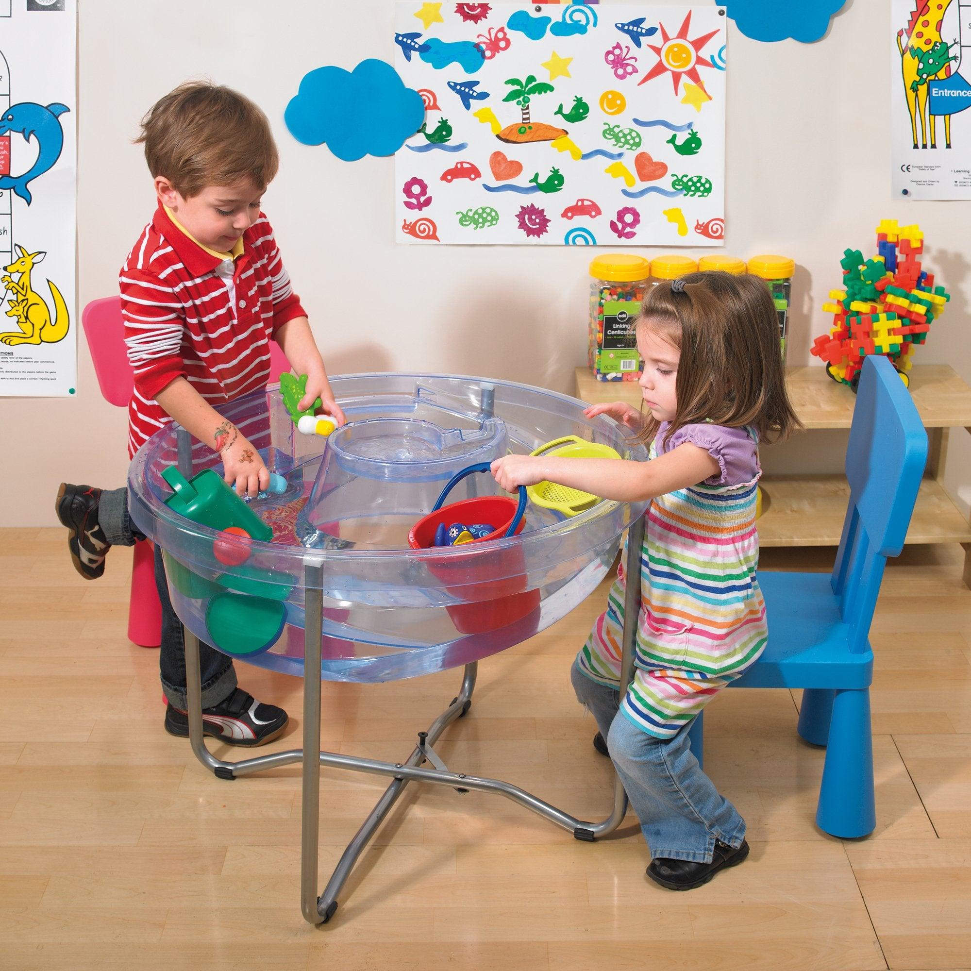 Circular Water Tray and Stand, Circular Water Tray and Stand.Circular Water Tray,Clear Sand and Water Table With Lid,children's water play table,childrens water table,childrens sand and water play, Circular Water Tray and Stand,The Circular Water Tray and stand set is a cleverly designed and versatile clear sand and water tray with central helter skelter for use as a water channel or roadway and an outer trough which together stimulate imaginative play. The Circular Water Tray and stand isThe Circular Water