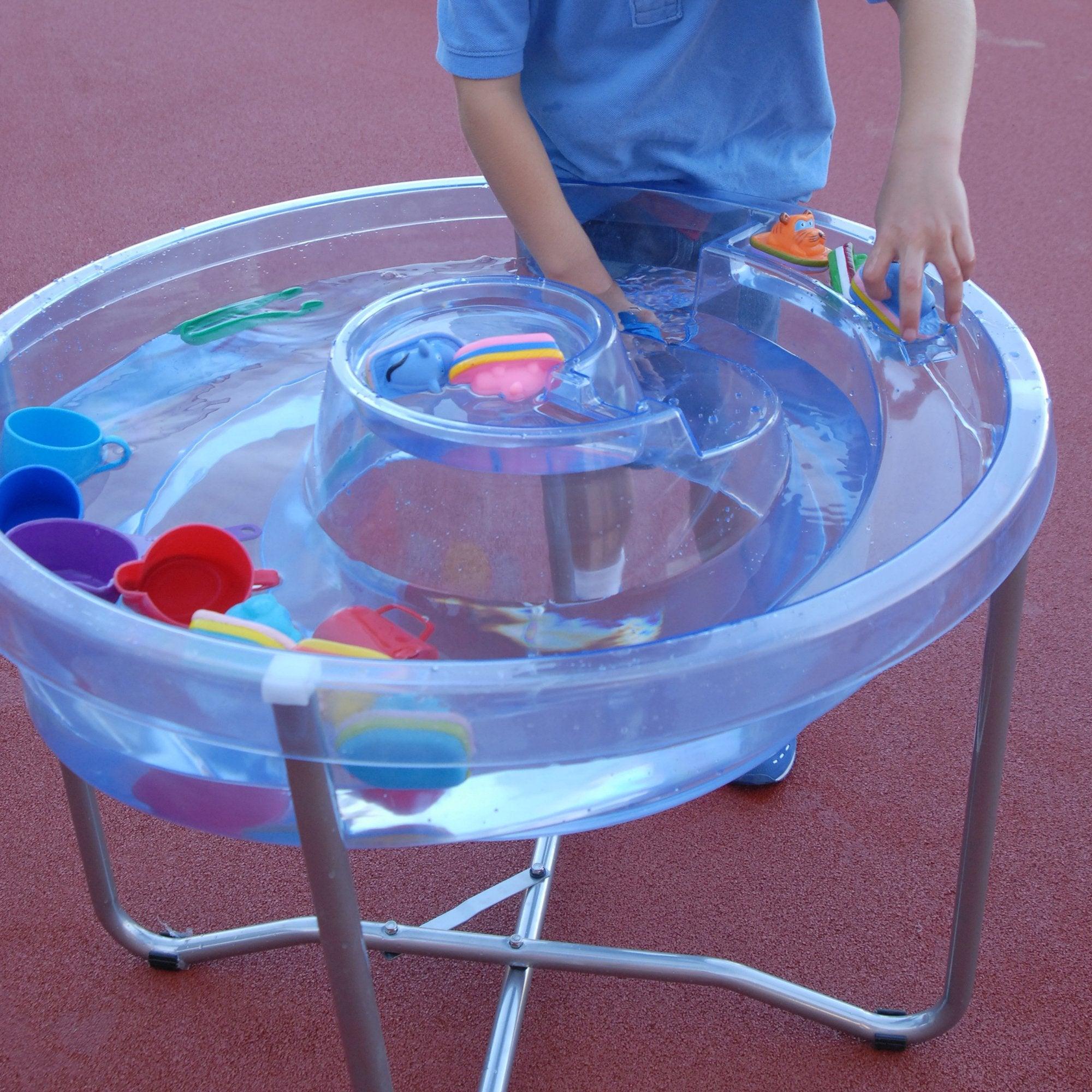 Circular Water Tray and Stand, Circular Water Tray and Stand.Circular Water Tray,Clear Sand and Water Table With Lid,children's water play table,childrens water table,childrens sand and water play, Circular Water Tray and Stand,The Circular Water Tray and stand set is a cleverly designed and versatile clear sand and water tray with central helter skelter for use as a water channel or roadway and an outer trough which together stimulate imaginative play. The Circular Water Tray and stand isThe Circular Water