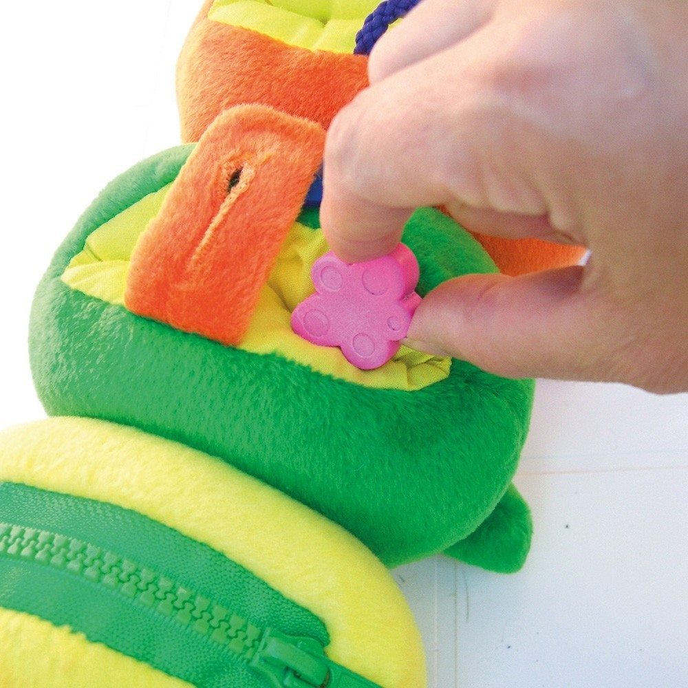 Fine Motor Millipede, Fine Motor Millipede,Fine Motor Skills toys,Dress a pillar style toy,zip toy,fine motor skills toys, Fine Motor Millipede Make learning life skills fun and engaging with the Fine Motor Millipede! This adorable, colourful caterpillar isn’t just a cuddly companion; it’s a hands-on learning tool designed to help children develop essential skills like dressing and fine motor coordination. The Fine Motor Millipede features a variety of interactive elements, including Velcro, laces, buttons,