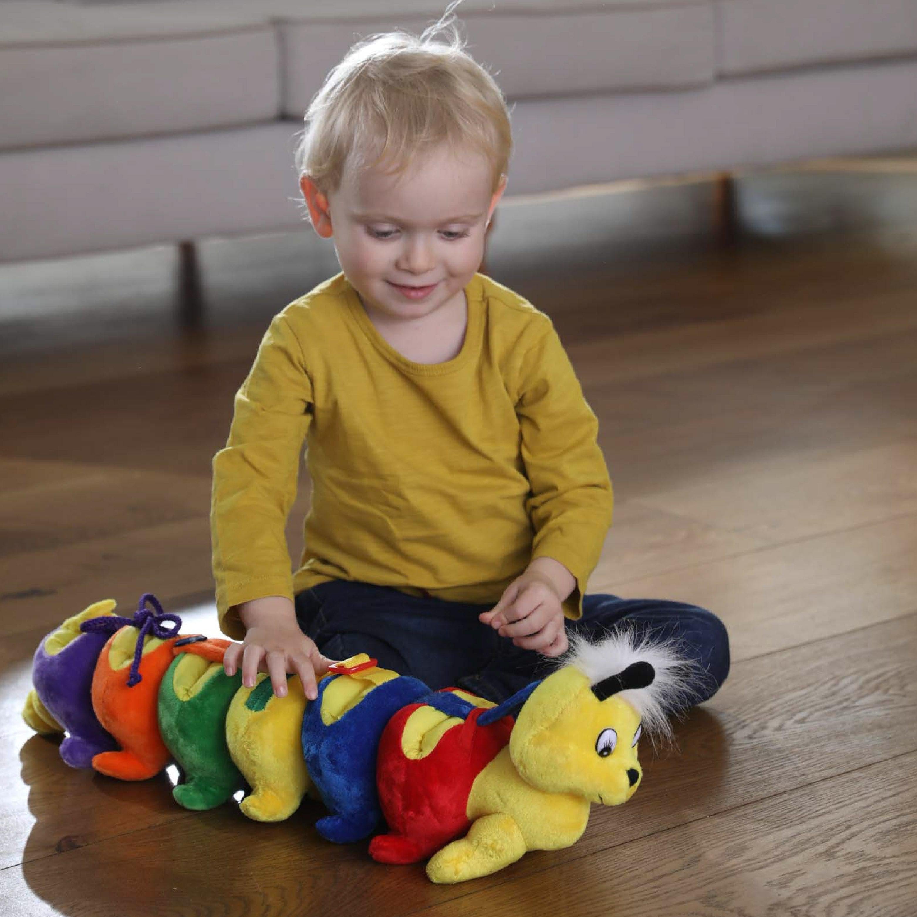 Fine Motor Millipede, Fine Motor Millipede,Fine Motor Skills toys,Dress a pillar style toy,zip toy,fine motor skills toys, Fine Motor Millipede Make learning life skills fun and engaging with the Fine Motor Millipede! This adorable, colourful caterpillar isn’t just a cuddly companion; it’s a hands-on learning tool designed to help children develop essential skills like dressing and fine motor coordination. The Fine Motor Millipede features a variety of interactive elements, including Velcro, laces, buttons,