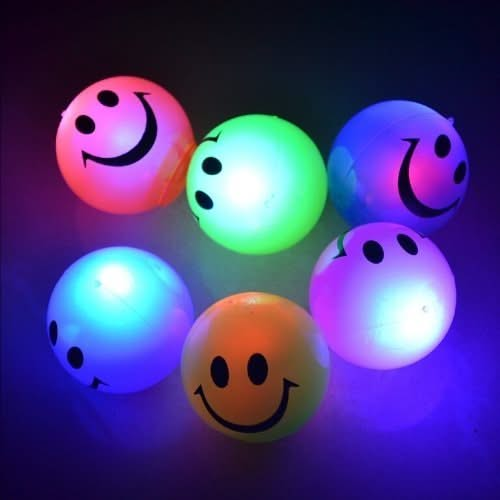 Flashing smiley face balls, flashing sensory toys,flashing sensory ball,dark den toys,dark dens,dark den toys,flashing ball,light up ball,light up ball toy,light up sensory toys,light up sensory toy,special needs light up toys,toys for special needs,cheap special needs toys, Flashing smiley face balls,Introducing the Flashing Smiley Face Ball, the epitome of fun-packed into a vibrantly coloured, soft and rubbery sphere. With a design that captivates, it promises not just a game, but an experience that glows