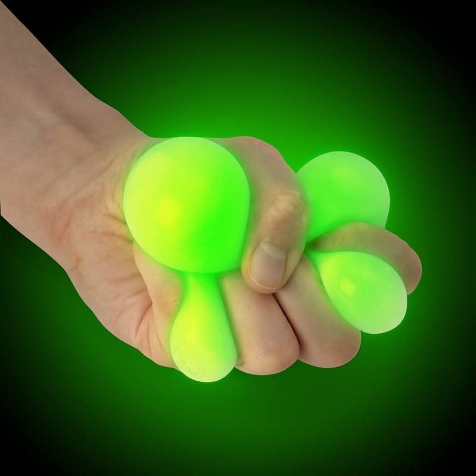 Glow in the Dark Squish Ball Fidget Toy, Glow in the Dark Squish Ball Fidget Toy, Glow in the dark squish ball. glow in the dark fidget toys, glow in the dark sensory toys, Glow in the Dark Squish Ball Fidget Toy,Glow in the Dark Squish Ball Fidget Toy – The Ultimate Stress Reliever! Introducing the Glow in the Dark Squish Ball, a super fun and calming fidget toy that glows bright green in the dark! While it appears as an 'off white' colour in normal light, after exposure to light or under UV blacklight, th