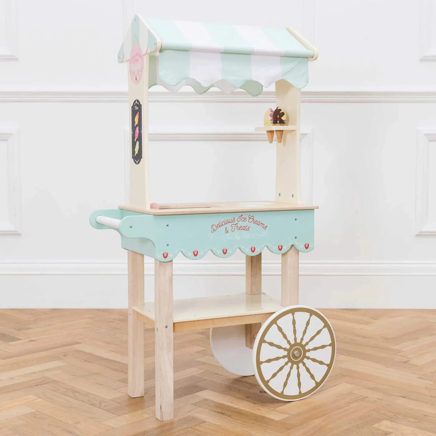 Ice Cream Trolley Market Stall, Ice Cream Trolley Market Stall,Le toy van,Pretend Play Toys,Role Play Toys,Christmas Toys, Ice Cream Trolley Market Stall – Sweet Treats & Classic Charm! Bring the joy of the fairground home with the Ice Cream Trolley Market Stall – a timeless wooden toy designed to spark imaginative play and inspire hours of creative fun. Crafted with a sprinkle of nostalgia, this stunning barrow-style trolley is the perfect addition to any playroom, encouraging role-play adventures filled w