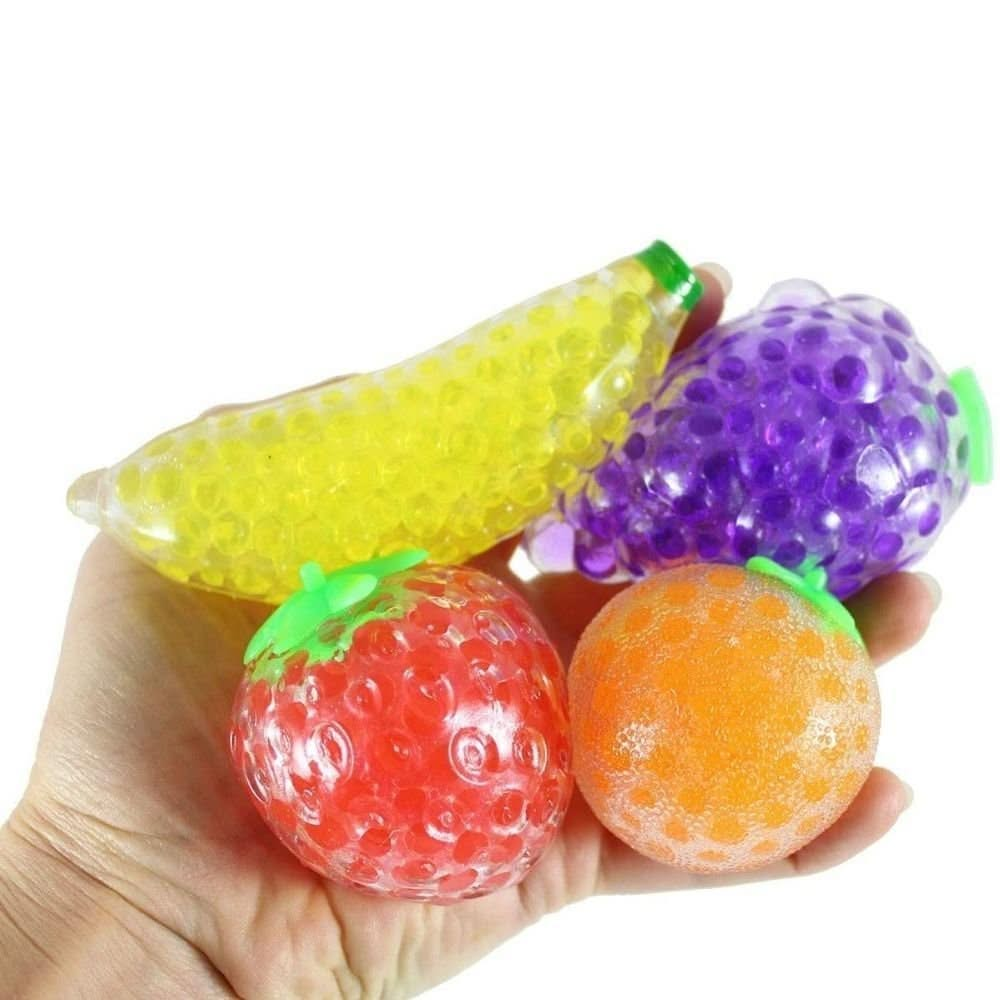 Jelly Ball Groovy Fruits 4 Pack, Jelly Ball Groovy Fruits 4 Pack,squishy bead fruits,squidgy bead fruits,Nee Doh groovy fruits,Nee doh stress ball,nee doh toys,sensory stress ball,autism stress ball, Jelly Ball Groovy Fruits 4 Pack – Squishy, Squeezy, & Super Fun! Add a burst of colourful, squishy fun to your day with the Jelly Ball Groovy Fruits 4 Pack! These soft, fruit-shaped stress balls provide a satisfying sensory experience, perfect for fidgeting, squeezing, and playful relaxation. Whether you're loo