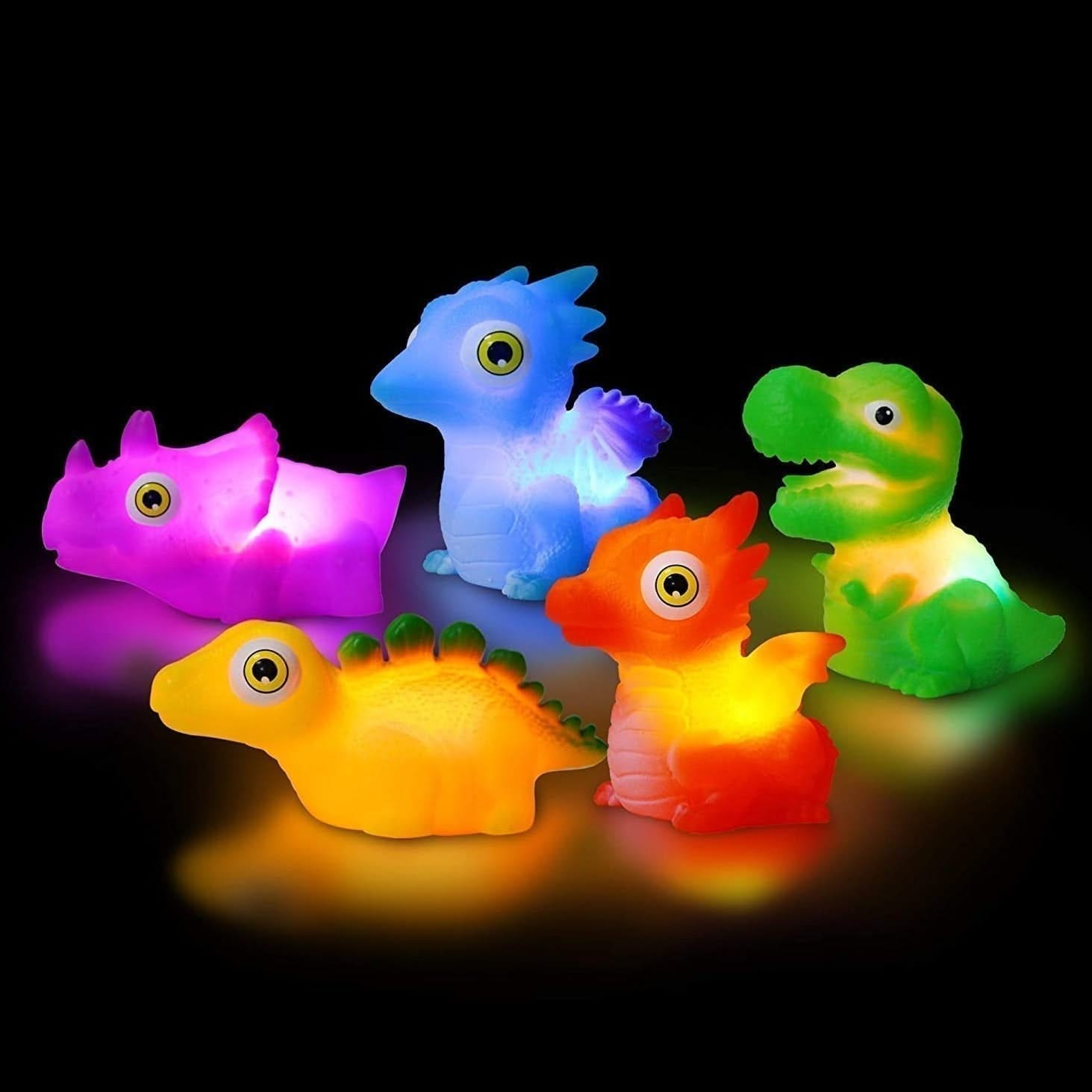 Light Up Dinosaur Bath Toy, Light up dinosaur bath toy,Light Up T-Rex Bath Toy,colour changing bath toys,cheap bath toys,bath ducks,childrens bath toys,bath toys,bath toys for toddlers,special needs bath toys,special needs bath games and toys, Light Up Dinosaur Bath Toy,Make bath time an exciting adventure with the Light Up Dinosaur Bath Toy! This incredible water activated bath light is shaped like a fearsome dinosaur and will instantly light up and flash as soon as it touches the water. Watch as your litt