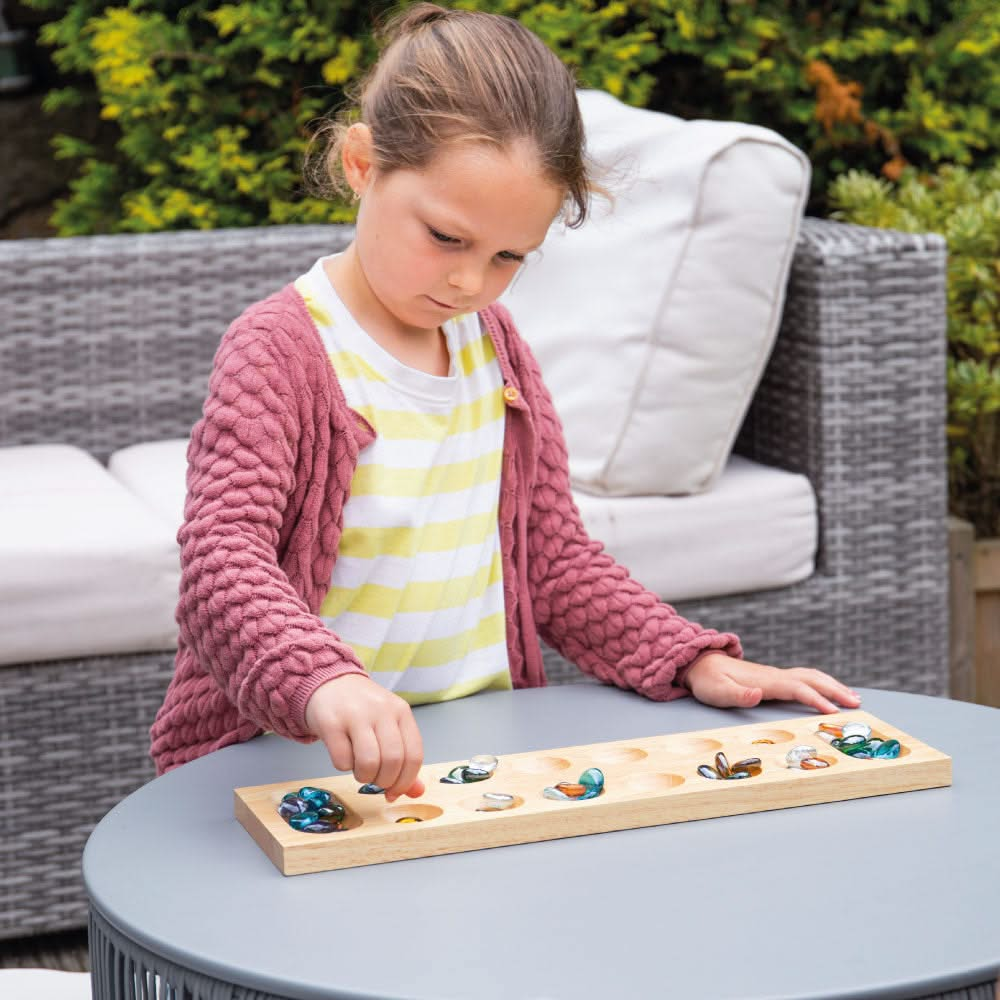 Mancala, Mancala,Bigjigs Mancala Game,Wooden Mancala Game,Counting Game, Bigjigs Mancala Game – A Classic Strategy Game for All Ages! Experience the timeless fun of Mancala, a strategic two-player board game that has been enjoyed for centuries. The Bigjigs Mancala Game combines tactical thinking, counting skills, and strategy, making it a perfect family-friendly game for players of all ages. Crafted from high-quality, responsibly sourced wood, this beautifully designed traditional board game is both durable