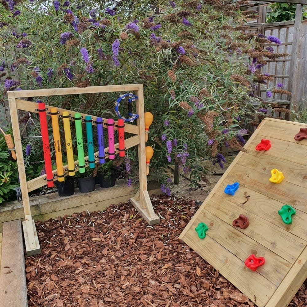 Outdoor Percussion Stand, Outdoor Percussion Stand,Outdoor Chimes, Children playground musical equipment, Musical equipment playground, Children's Playground equipment, school playground equipment, school playground wooden houses, Outdoor Percussion Stand,Soothing musical and colourful chimes bringing music to any garden. A set of eight multicoloured chimes mounted on a robust free-standing timber frame. Our Outdoor percussion stand is all about fun learning. Improving fine and gross motor skills and aids i