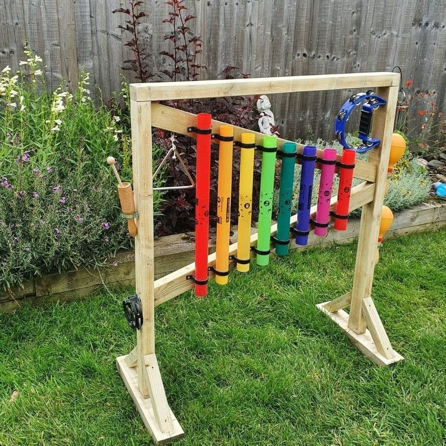 Outdoor Percussion Stand, Outdoor Percussion Stand,Outdoor Chimes, Children playground musical equipment, Musical equipment playground, Children's Playground equipment, school playground equipment, school playground wooden houses, Outdoor Percussion Stand,Soothing musical and colourful chimes bringing music to any garden. A set of eight multicoloured chimes mounted on a robust free-standing timber frame. Our Outdoor percussion stand is all about fun learning. Improving fine and gross motor skills and aids i