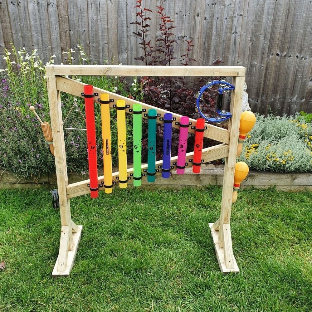 Outdoor Percussion Stand, Outdoor Percussion Stand,Outdoor Chimes, Children playground musical equipment, Musical equipment playground, Children's Playground equipment, school playground equipment, school playground wooden houses, Outdoor Percussion Stand,Soothing musical and colourful chimes bringing music to any garden. A set of eight multicoloured chimes mounted on a robust free-standing timber frame. Our Outdoor percussion stand is all about fun learning. Improving fine and gross motor skills and aids i