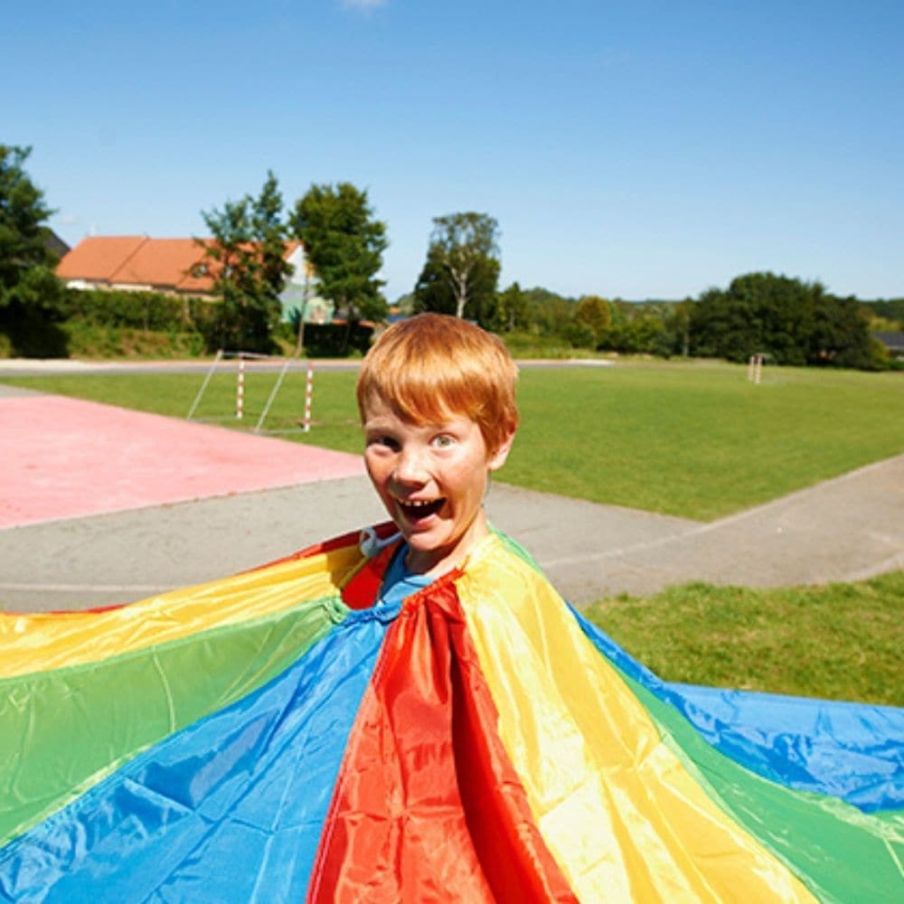 Parachute Games 9 metres, Parachute play is a novel and fun way of encouraging new skills and development. This 9 Metre Parachute is colourful and sometimes calming, it can create soft, whispering sounds, or loud rippling noises, depending on how quickly it is moved. Working together encourages co-operation, trust, communication and social skills. Parachute Games also encourage movement of muscles in the upper body. Games can involve touching the soft parachute fabric, moving or lying beneath or over it, an