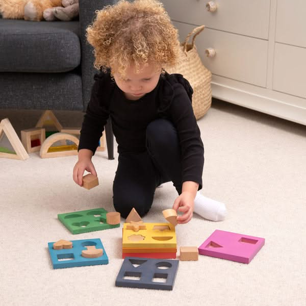 Rainbow Wooden Shape Stacker, Rainbow Wooden Shape Stacker,TickIT Rainbow Wooden Shape Stacker,Rainbow Wooden Shape Stacker, Rainbow Wooden Shape Stacker,Our TickiT® Rainbow Wooden Shape Stacker is a colourful and fun puzzle to help your child with shape recognition and problem solving skills. Made from beautiful smooth solid beechwood with a natural woodgrain finish in the 7 different colours of the rainbow. The 12 tactile shape cut outs nest inside a rounded squareOur TickiT® Rainbow Wooden Shape Stacker 