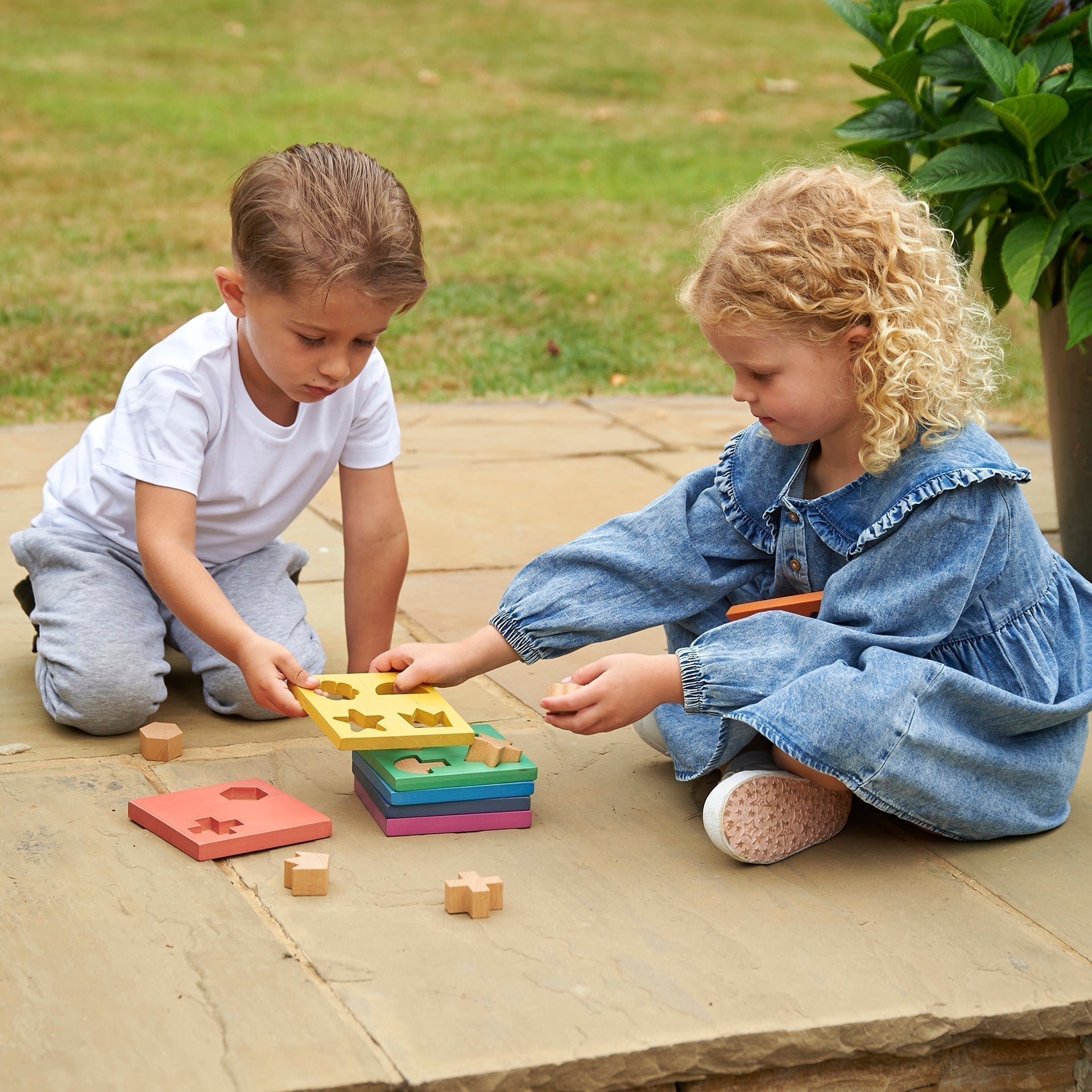 Rainbow Wooden Shape Stacker, Our TickiT® Rainbow Wooden Shape Stacker is a colourful and fun puzzle to help your child with shape recognition and problem solving skills. Made from beautiful smooth solid beechwood with a natural woodgrain finish in the 7 different colours of the rainbow. The 12 tactile shape cut outs nest inside a rounded square panel so your child can practice fitting them into their matching shaped hole or stack them to build a rainbow shape tower. The wooden panels are red, orange, yello