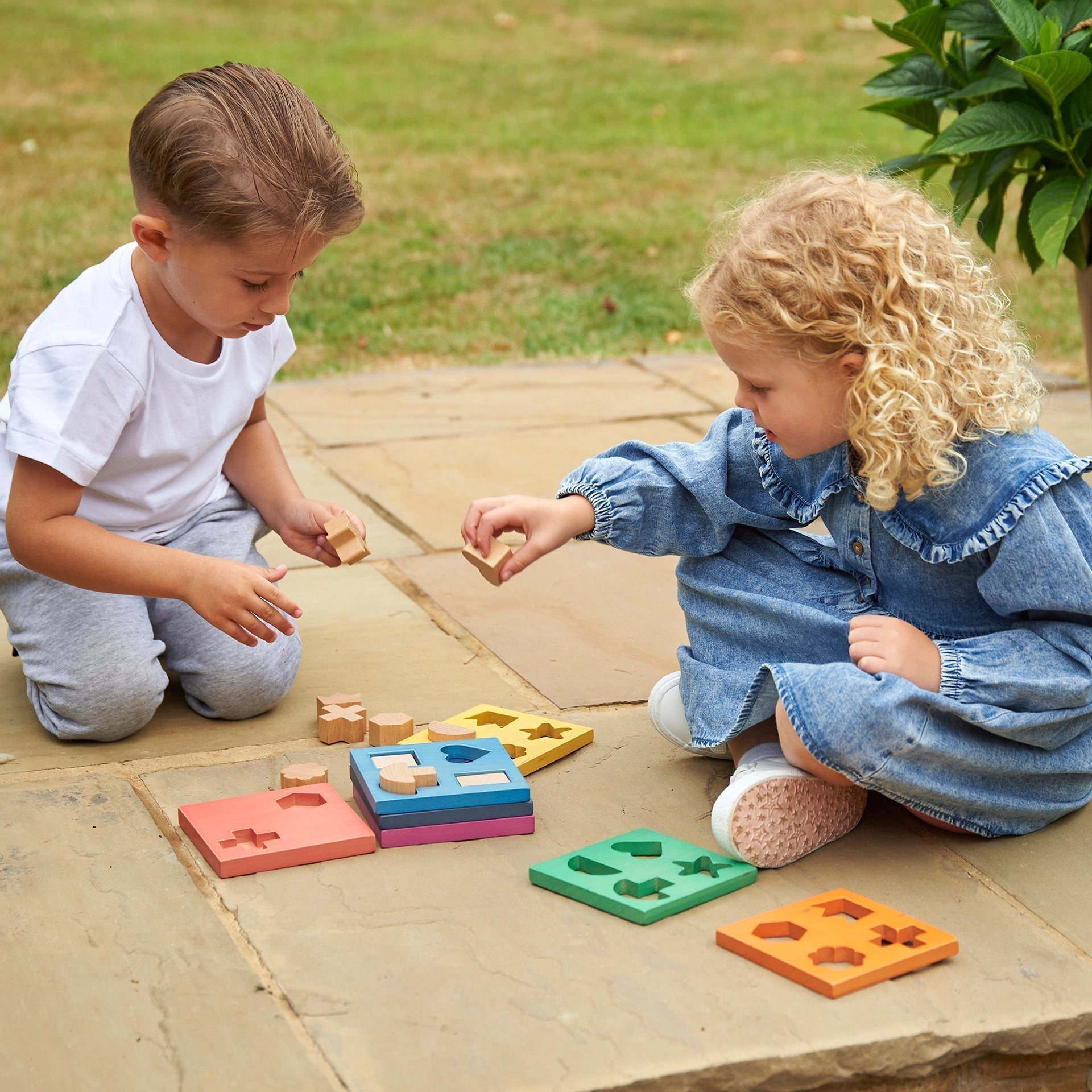 Rainbow Wooden Shape Stacker, Our TickiT® Rainbow Wooden Shape Stacker is a colourful and fun puzzle to help your child with shape recognition and problem solving skills. Made from beautiful smooth solid beechwood with a natural woodgrain finish in the 7 different colours of the rainbow. The 12 tactile shape cut outs nest inside a rounded square panel so your child can practice fitting them into their matching shaped hole or stack them to build a rainbow shape tower. The wooden panels are red, orange, yello