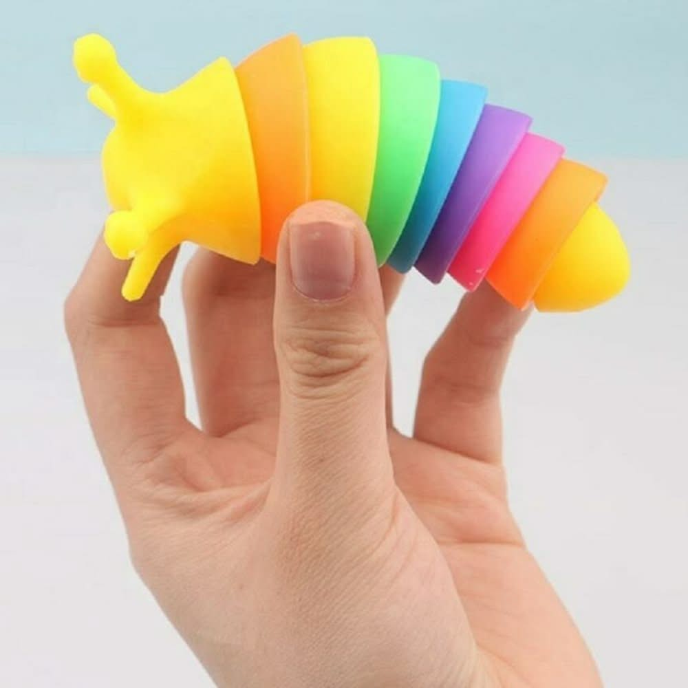 Slug Fidget Toy 10cm Rainbow, Slug Fidget Toy 10cm Rainbow,Rainbow Fidget Slug sensory slug,sensory fidget toy,,Sensory Toys, Special Needs Toys, Stretchy centipede, Stretchy character, Tentacle centipede toy, tactile toys, stretchy and squidgy toys, Slug Fidget Toy – Colourful, Engaging, and Addictive Sensory Fun Get ready for hours of sensory satisfaction with our Slug Fidget Toy! Measuring 10cm, this vibrant rainbow-coloured fidget toy is designed to twist, bend, compress, and extend, producing a uniquel