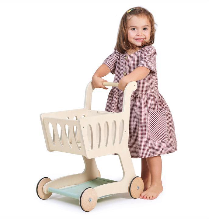 Tender Leaf Toys Shopping Cart, Tender Leaf Toys Shopping Cart,Shopping Trolley,Childrens shopping trolley,shopping trolley toy.kids shopping trolley, Tender Leaf Toys Shopping Cart – A Stylish Wooden Toy for Imaginative Play Bring the joy of shopping to life with the Tender Leaf Toys Shopping Cart, a beautifully designed wooden toy that inspires creativity and role play. Whether children are stocking up on essentials or exploring a make-believe supermarket, this charming shopping trolley is the perfect com