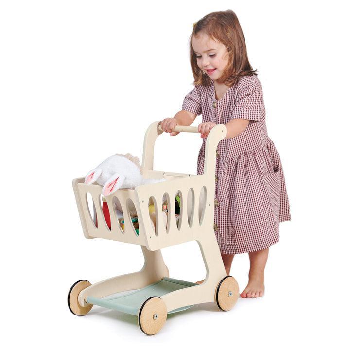 Tender Leaf Toys Shopping Cart, Tender Leaf Toys Shopping Cart,Shopping Trolley,Childrens shopping trolley,shopping trolley toy.kids shopping trolley, Tender Leaf Toys Shopping Cart – A Stylish Wooden Toy for Imaginative Play Bring the joy of shopping to life with the Tender Leaf Toys Shopping Cart, a beautifully designed wooden toy that inspires creativity and role play. Whether children are stocking up on essentials or exploring a make-believe supermarket, this charming shopping trolley is the perfect com