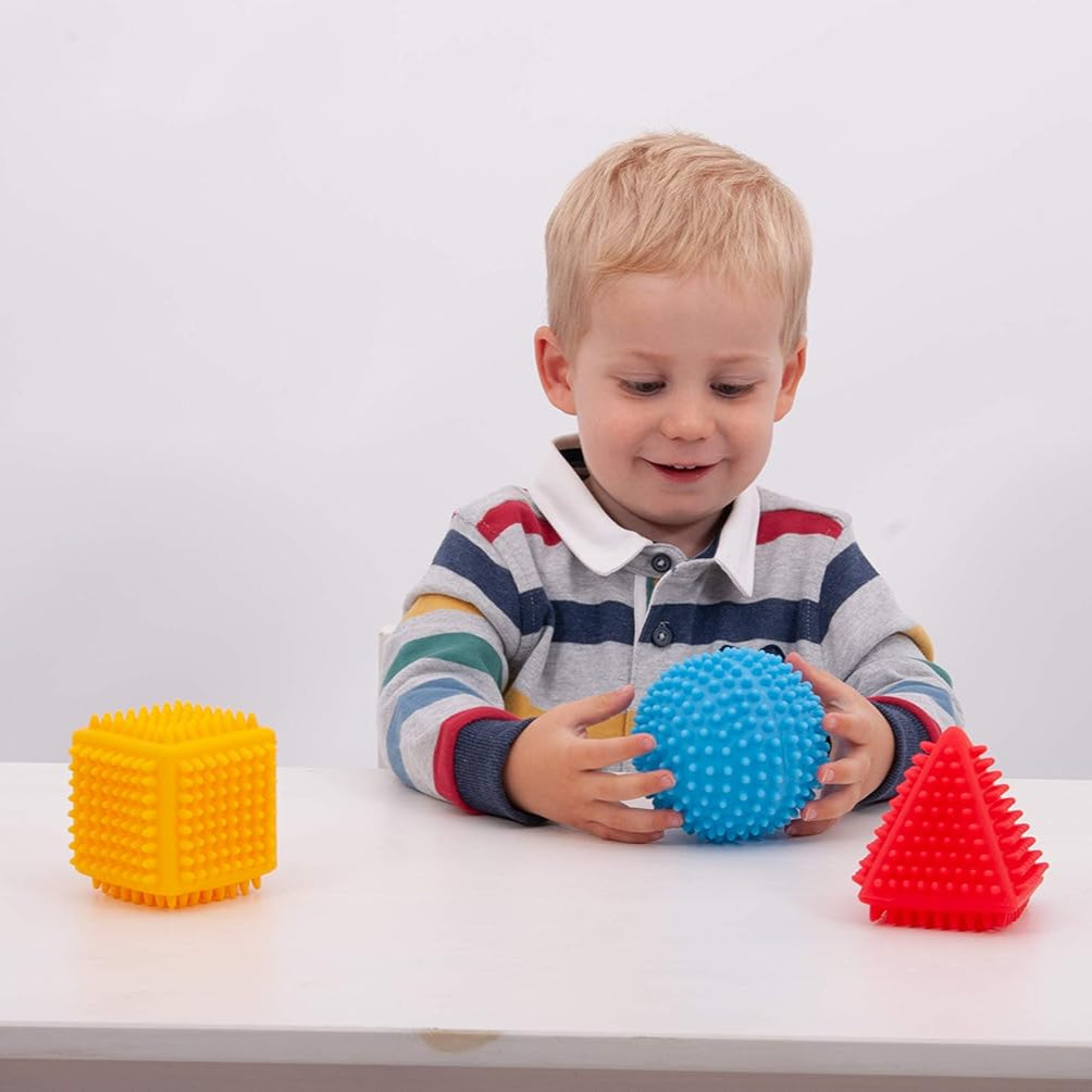 TickiT Sensory Shape Set, TickiT Sensory Shape Set,Sensory Balls,Sensory Shapes, TickiT Sensory Shape Set The TickiT Sensory Shape Set is a versatile and engaging educational tool, specifically designed to captivate young minds while promoting essential motor skill development. Perfect for early years, this delightful set of tactile 3D shapes is an excellent way to combine play and learning, making it ideal for children aged 12 months and above. Each shape in the TickiT Sensory Shape Set is designed with li