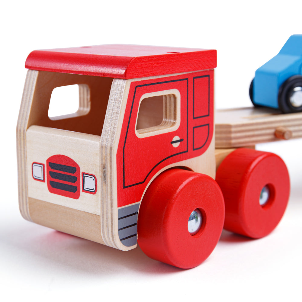 Transporter Lorry, Transporter Lorry,Wooden toys,Traditional wooden toy cars lorries,bigjigs ball fall,bigjigs toys,traditional wooden toys,childrens wooden toys,durable wooden toys,educational wooden toys, Transporter Lorry,This wooden Transporter Lorry Toy helps to develop kids’ dexterity and coordination as they play. It carries a load of four colourful wooden cars (which slot nicely onto the trailer) and is safe for little hands to play with. The toy car transporter lorry’s upper deck can be easily lowe