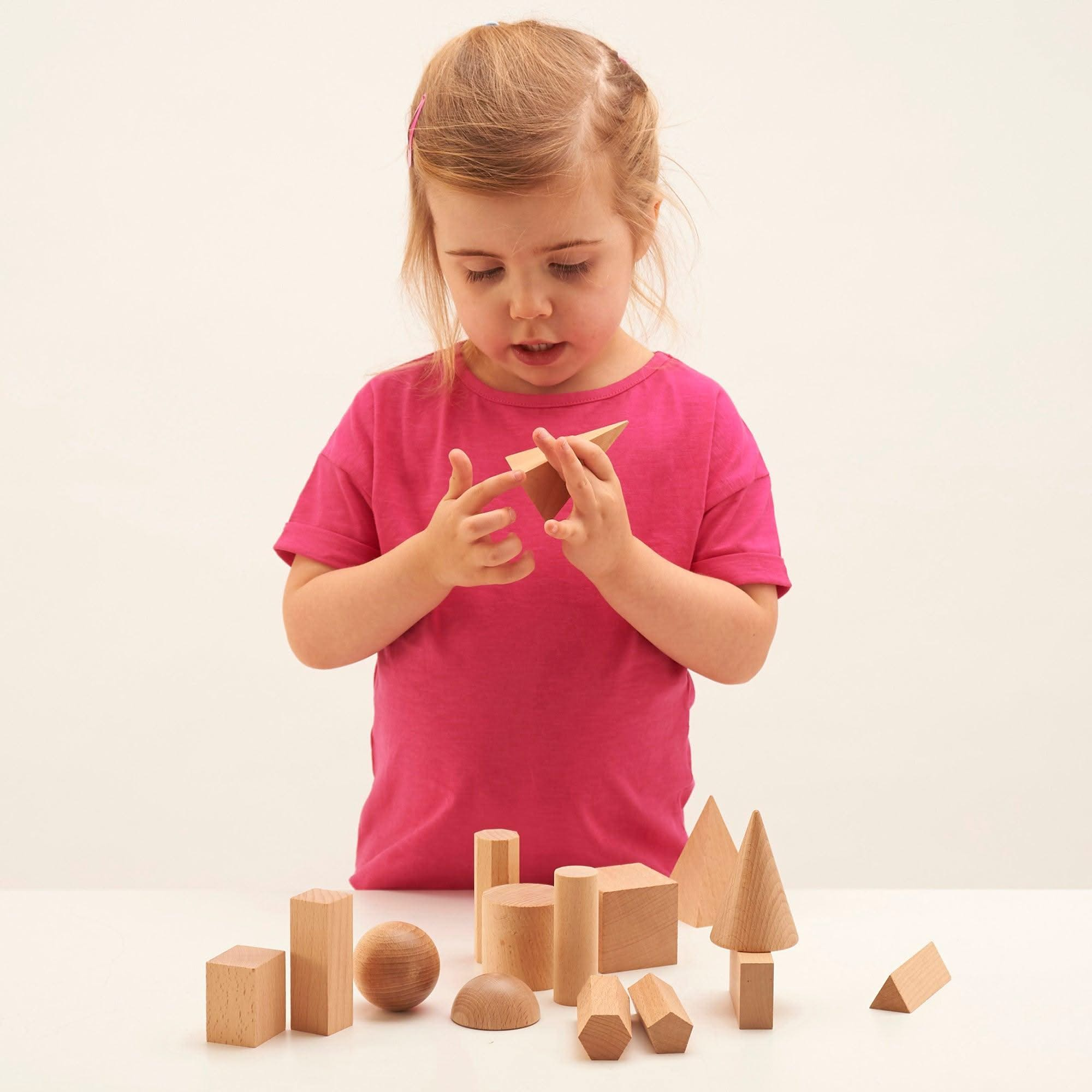 Wooden Geometric Solids - Pk15, Wooden Geometric Solids - Pk15,Geometric shapes,Reception and KS1 geometry resources,geometry resources EYFS, Wooden Geometric Solids – 15-Piece Set for Hands-On Learning The Wooden Geometric Solids set is an essential educational resource to enhance shape recognition, spatial awareness, and mathematical understanding. Made from smooth, durable hardwood, this 15-piece set provides a hands-on approach to exploring the properties and attributes of 3D geometric shapes. Wooden Ge