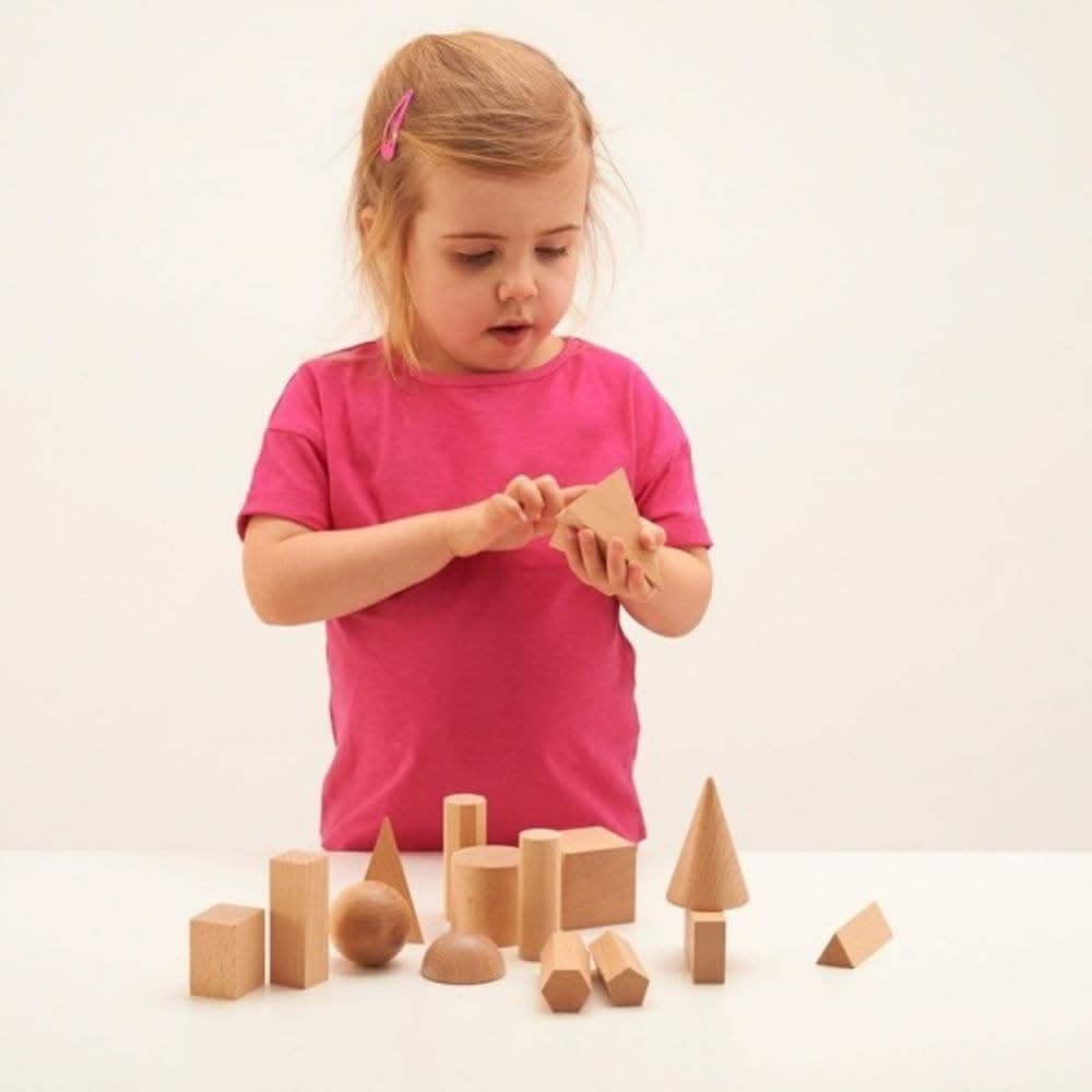 Wooden Geometric Solids - Pk15, Wooden Geometric Solids - Pk15,Geometric shapes,Reception and KS1 geometry resources,geometry resources EYFS, Wooden Geometric Solids – 15-Piece Set for Hands-On Learning The Wooden Geometric Solids set is an essential educational resource to enhance shape recognition, spatial awareness, and mathematical understanding. Made from smooth, durable hardwood, this 15-piece set provides a hands-on approach to exploring the properties and attributes of 3D geometric shapes. Wooden Ge